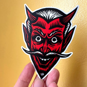 Devil Sticker in hand